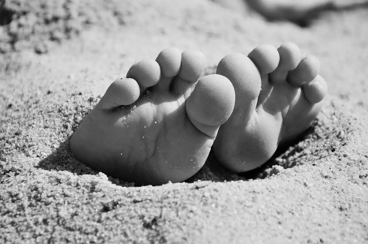 Humility: close to the earth. Feet on sand.